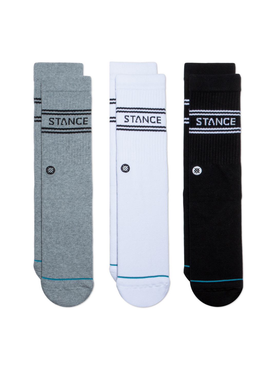 Three pairs of socks in grey, white and black, with "STANCE" logos and embroidered circular icon