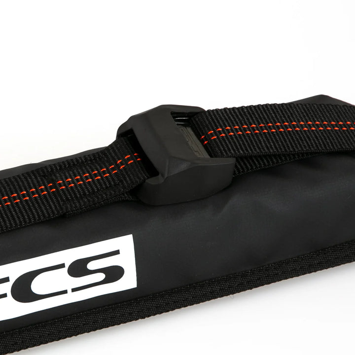 Black strap with orange stitching and FCS logo on a white background
