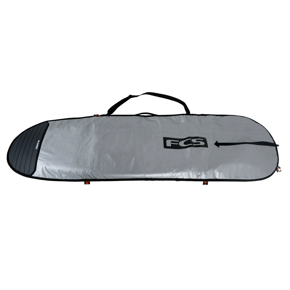Silver surfboard bag with FCS logo on a white background