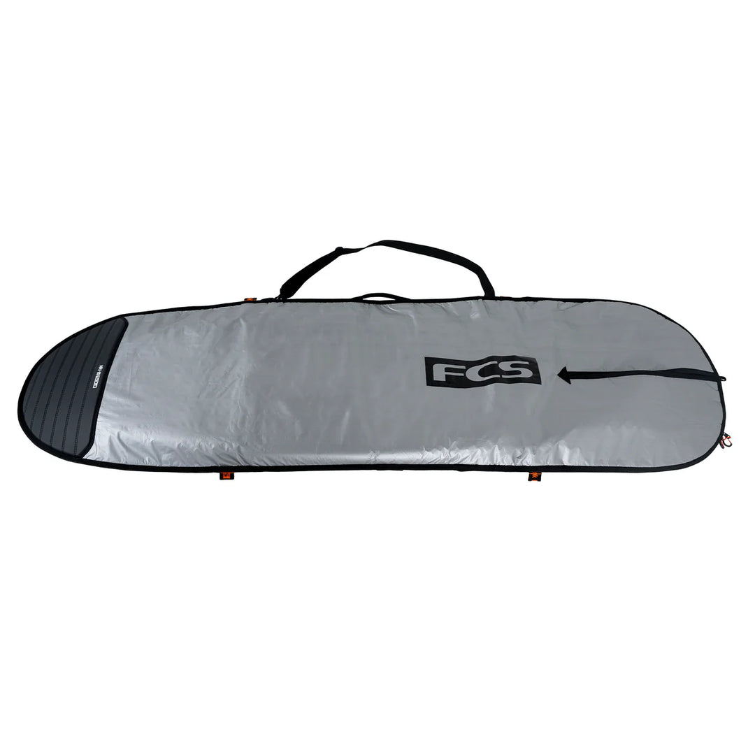 Silver surfboard bag with FCS logo on a white background