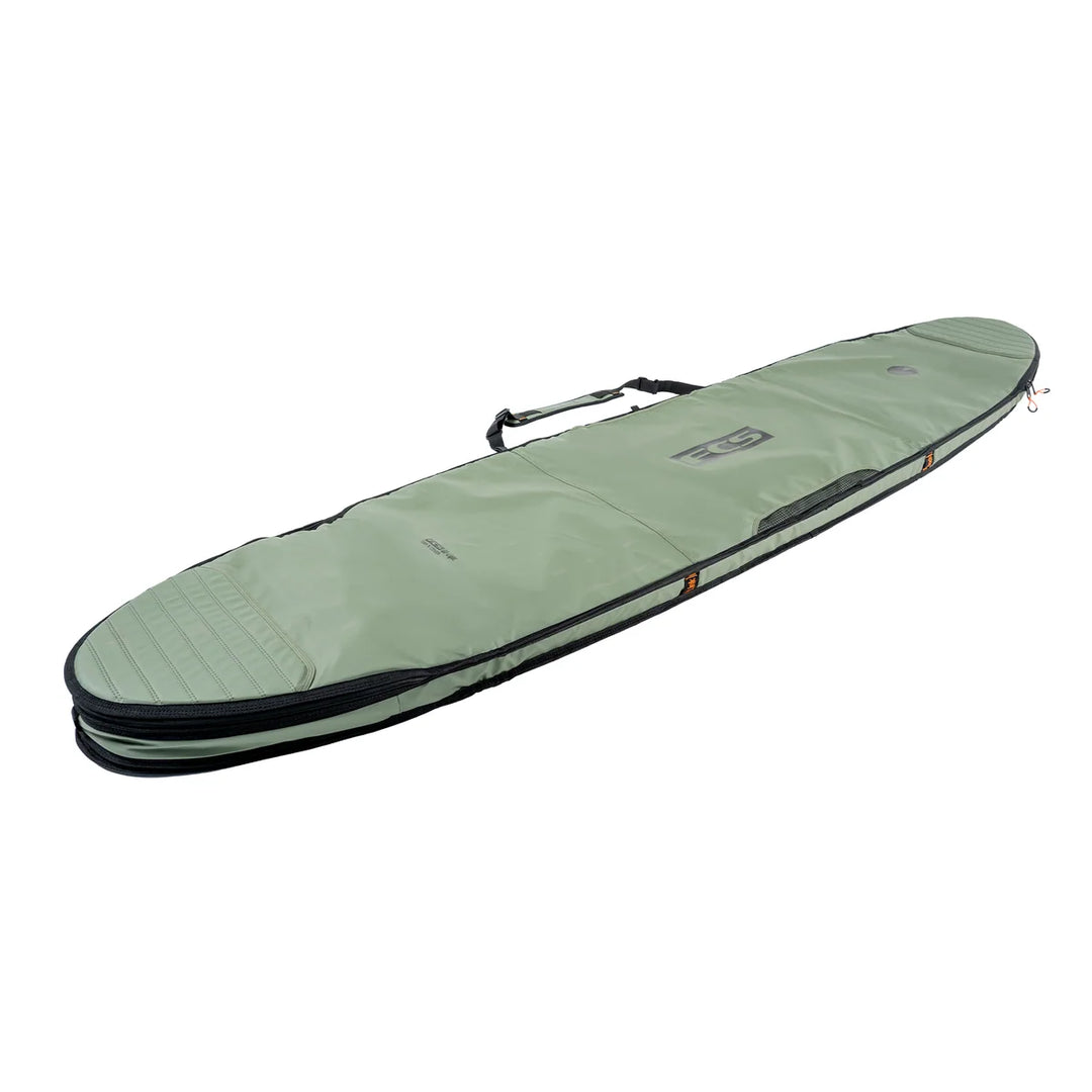 FCS Day-X longboard travel bag in Alpine green, angled view showing handles and zipped edge.