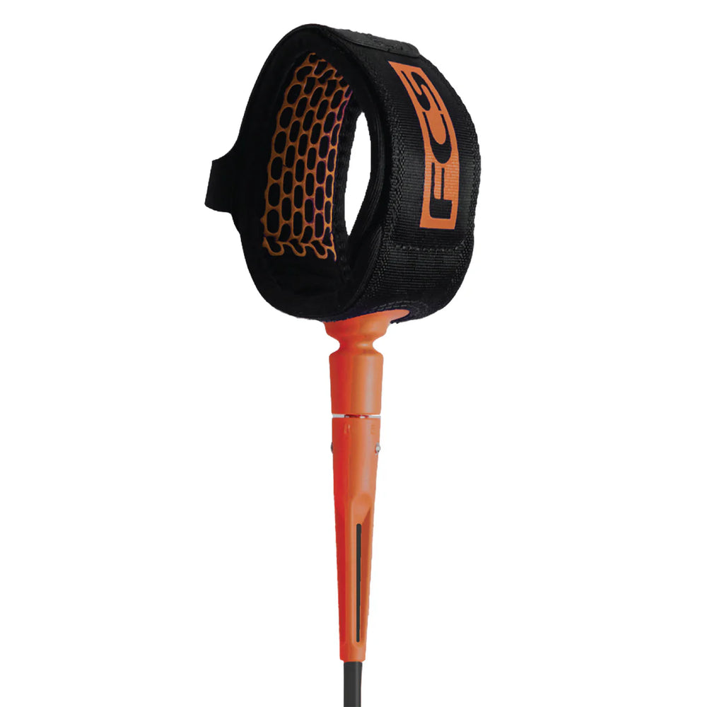 Orange and black surfboard leash with FCS brand logo on a white background