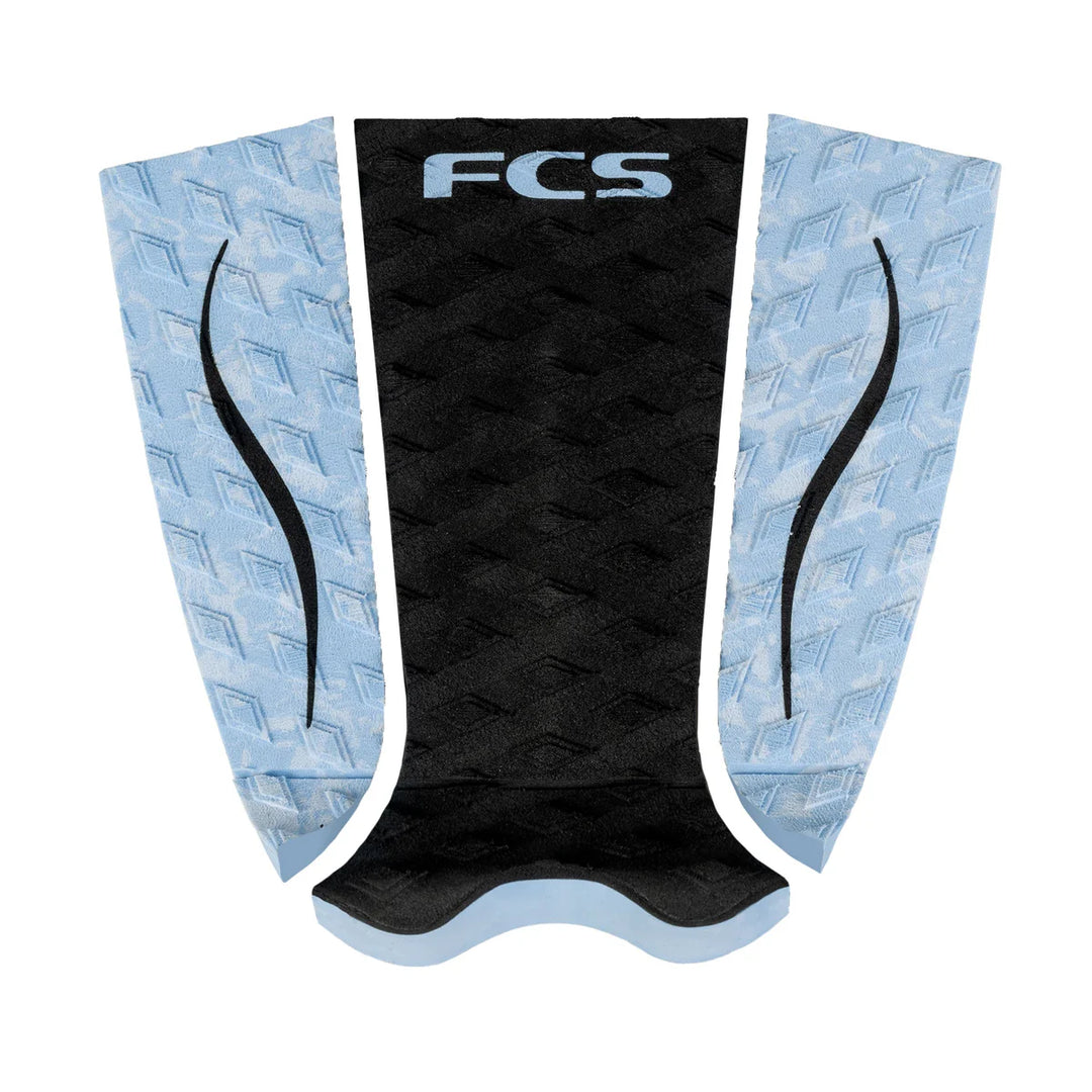 FCS branded surfboard tail pad with black centre and light blue sides on a white background