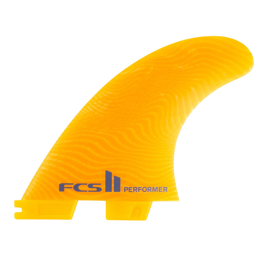 Yellow surf fin with FCS II Performer branding on a white background