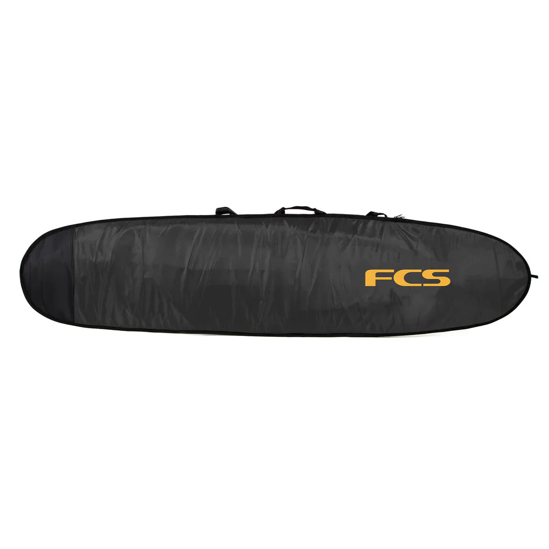 Black FCS surfboard bag with orange logo on a white background