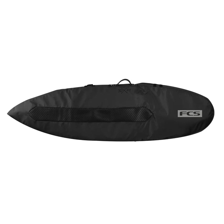 Black FCS surfboard bag on a white background