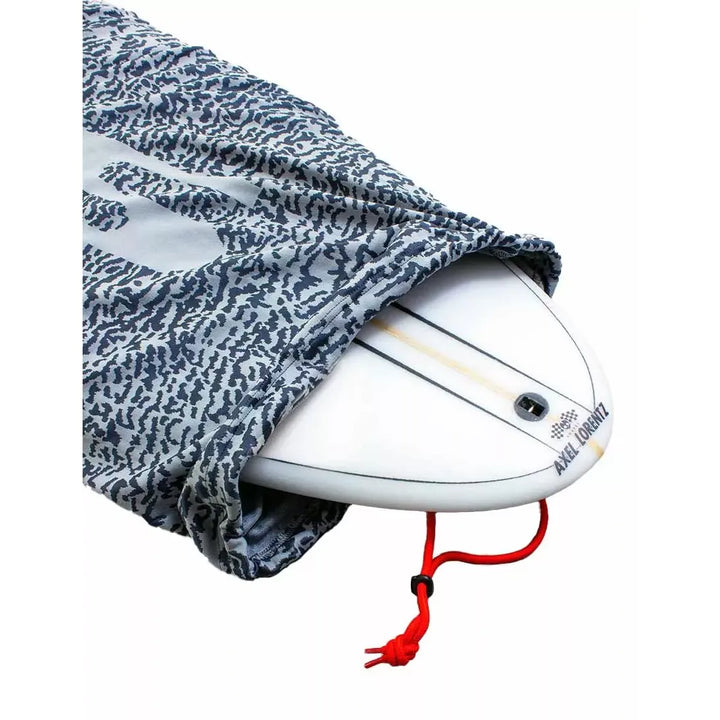 White surfboard with a camouflage cover on a white background