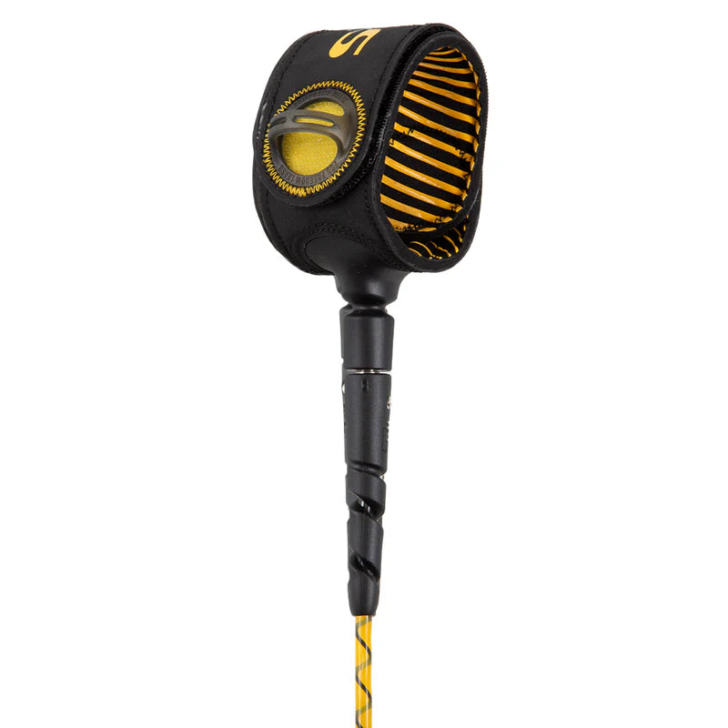 Black and yellow ankle strap of a surfboard leash on a white background