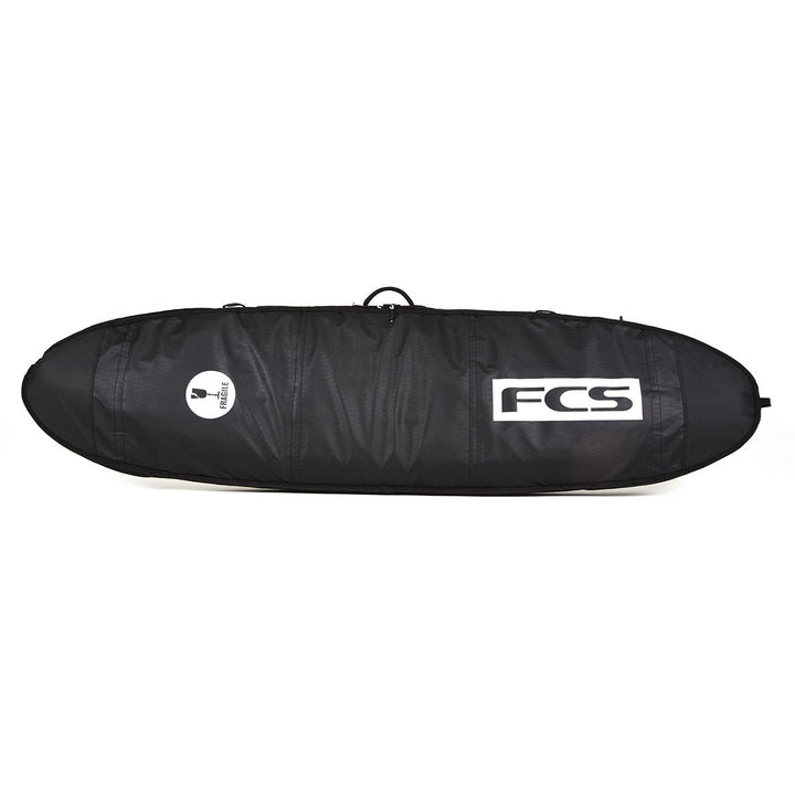 Black FCS surfboard bag on a white background