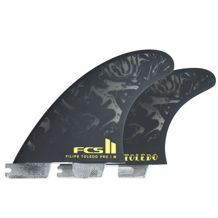 Two black surfboard fins with yellow branding on a white background