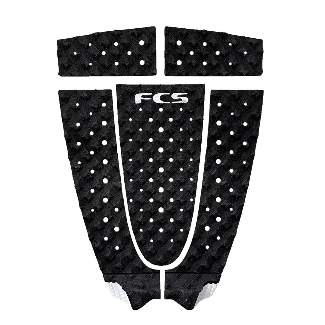 Black FCS surfboard tail pad with white text on a white background