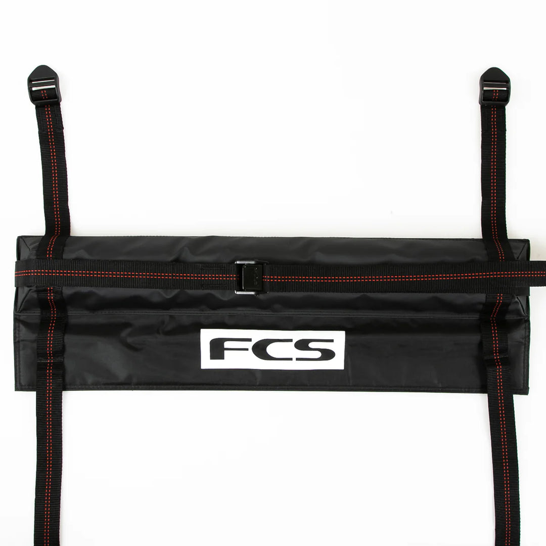 Black strap holder with FCS logo on a white background