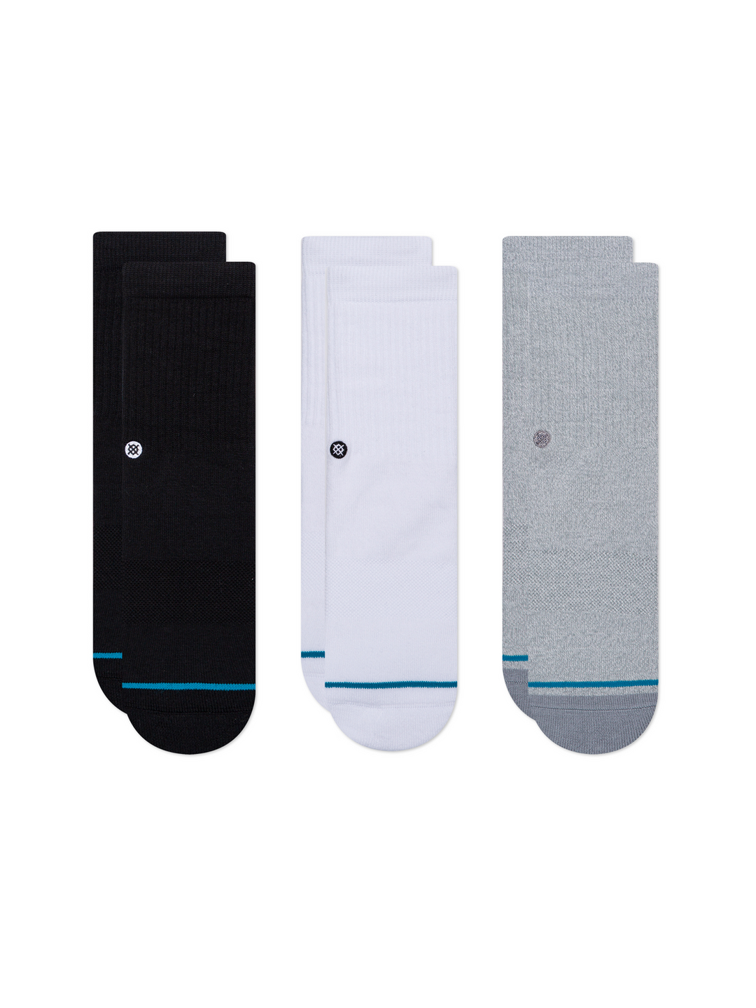 Three pairs of Stance crew socks displayed side-by-side on a plain white background. The left pair is black with a teal stripe near the toe.