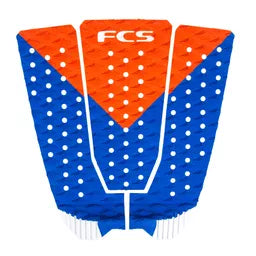 Blue and orange FCS surfboard tail pad on a white background