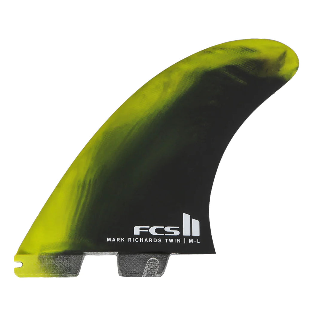 Green and black surfboard fin with FCS logo on a white background
