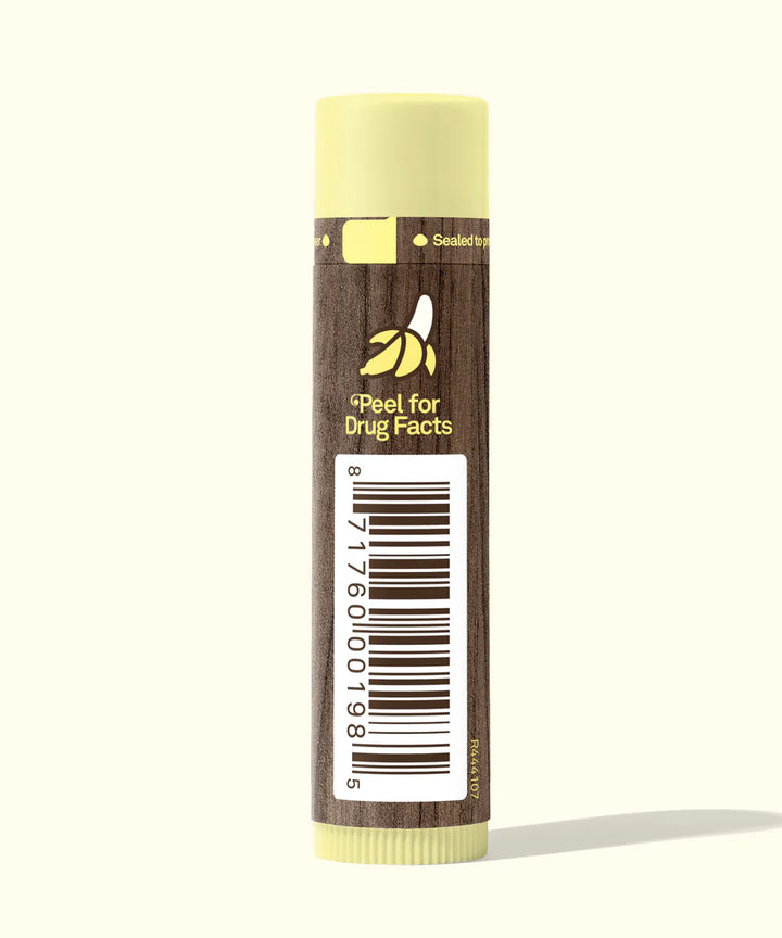 Lip balm with a brown label and barcode on a white background