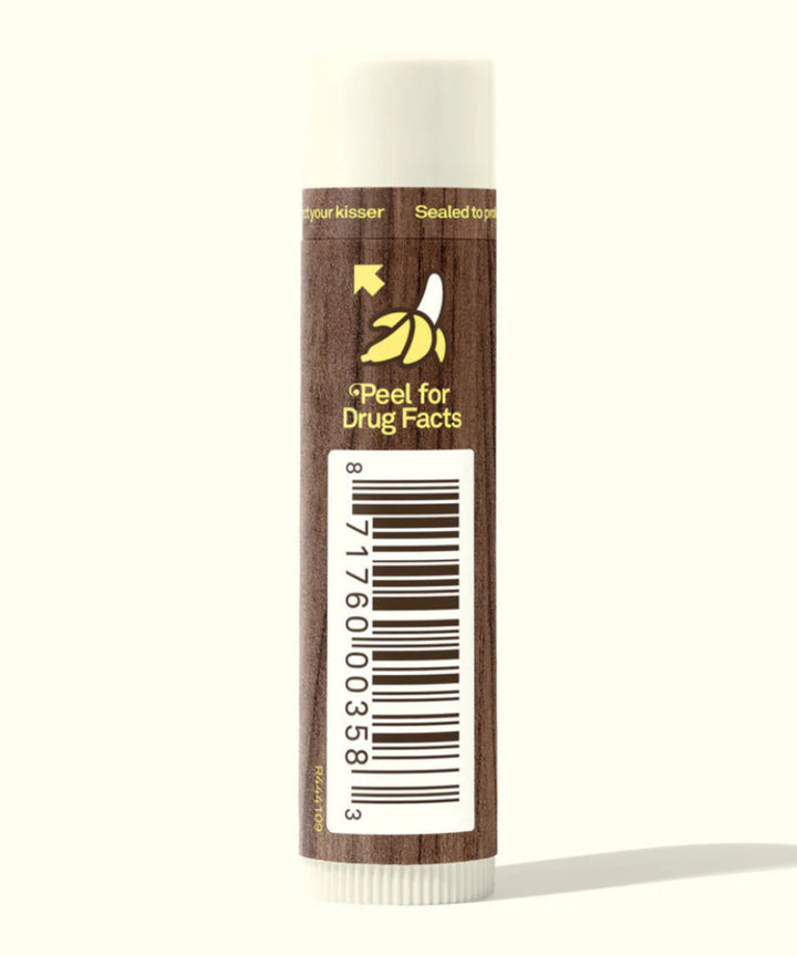 Lip balm with a brown tube and white cap on a white background