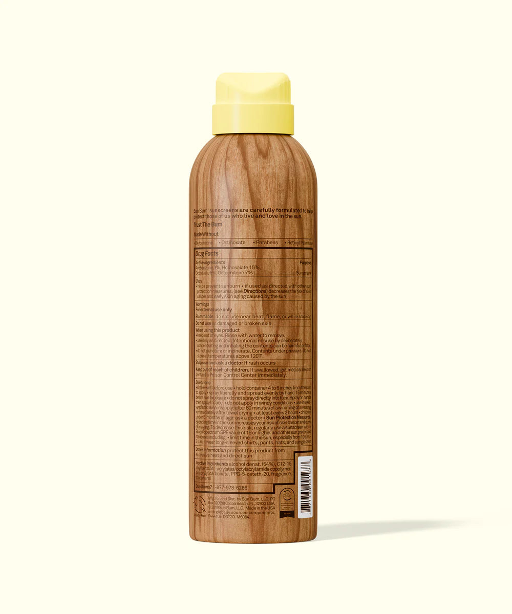 Wooden bottle with a yellow cap on a white background