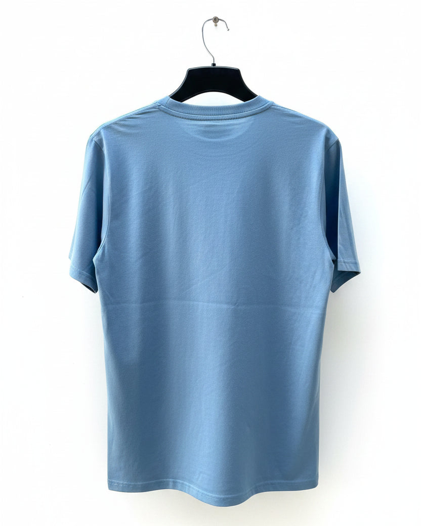 A light blue short-sleeve crewneck t-shirt hanging on a black hanger against white background.