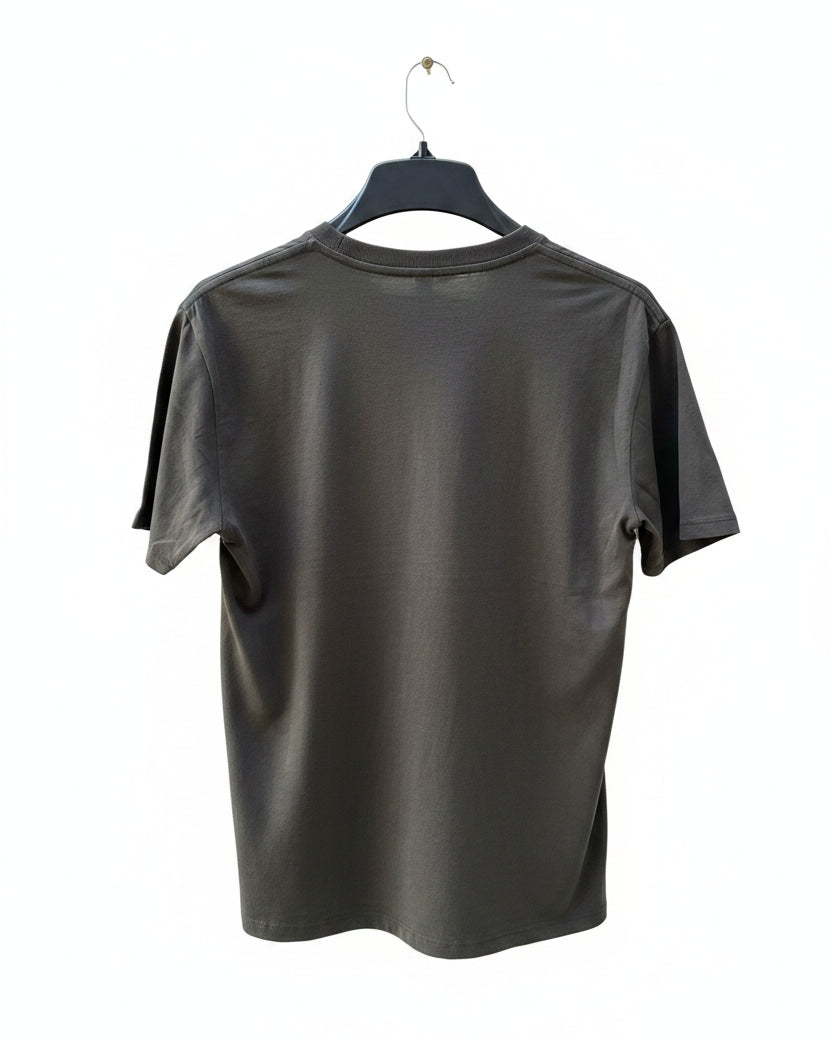 Black t-shirt on a hanger with a white background.