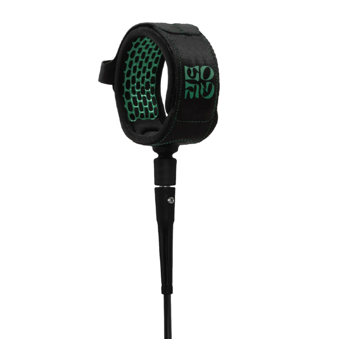 Black and Green FCS surfboard leash on a transparent background.