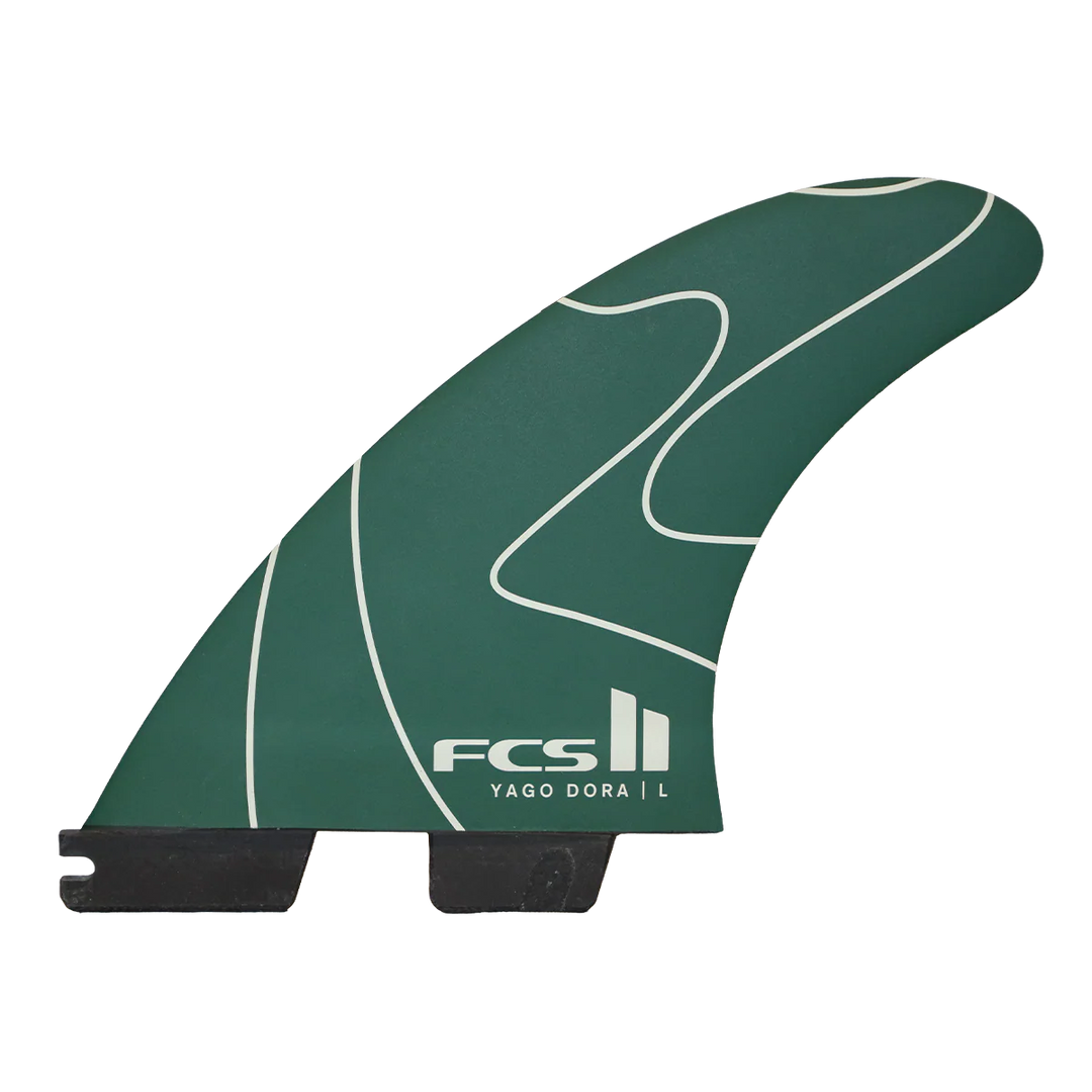 Green surf fin with FCS logo on a white background