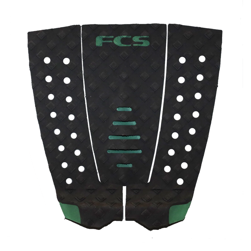 Black and green FCS surfboard tail pad on a white background