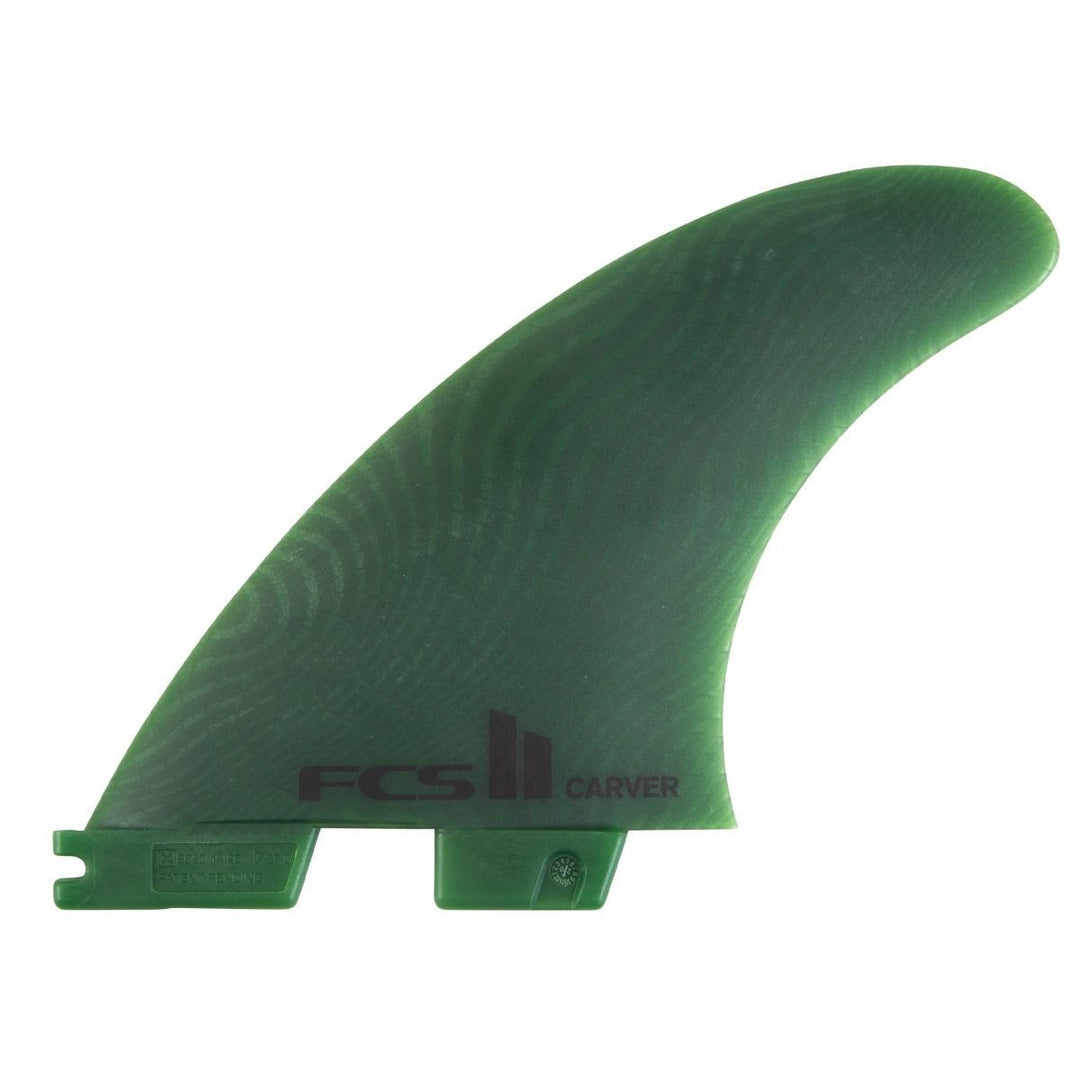 Green surfboard fin with FCS logo on a white background
