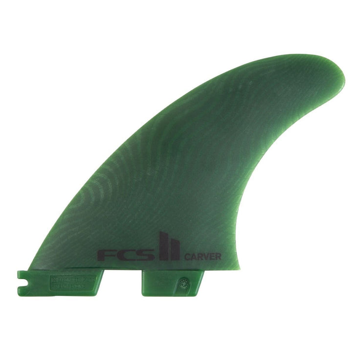 Green surfboard fin with FCS logo on a white background