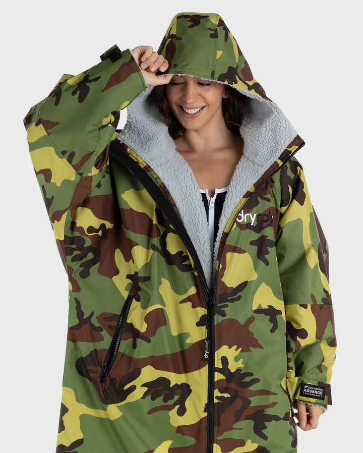 Camouflage Dryrobe with grey lining worn by a person on a white background