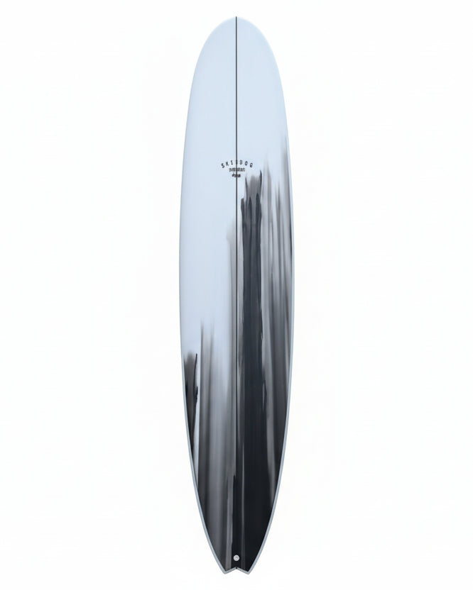 Surfboard leaning against a white background